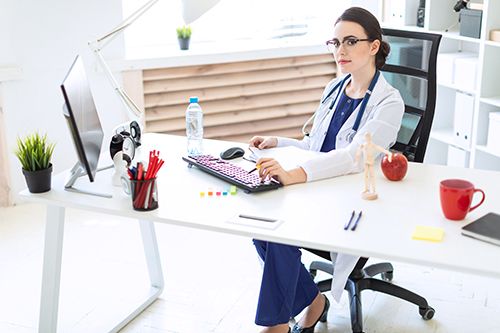 physiotherapist using a computer